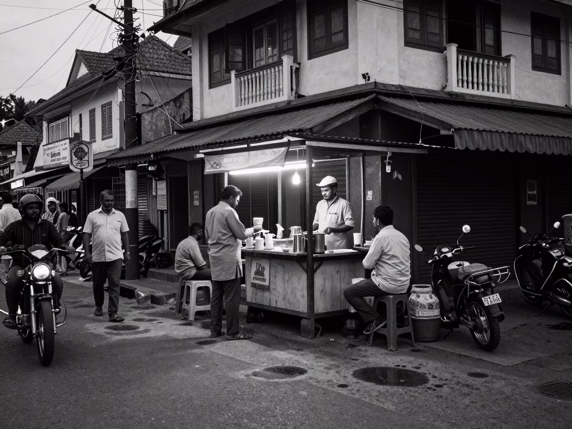 Busy Kochi Street Corner Evening Scene with Tea Stains and Local Life in in Kochi, India