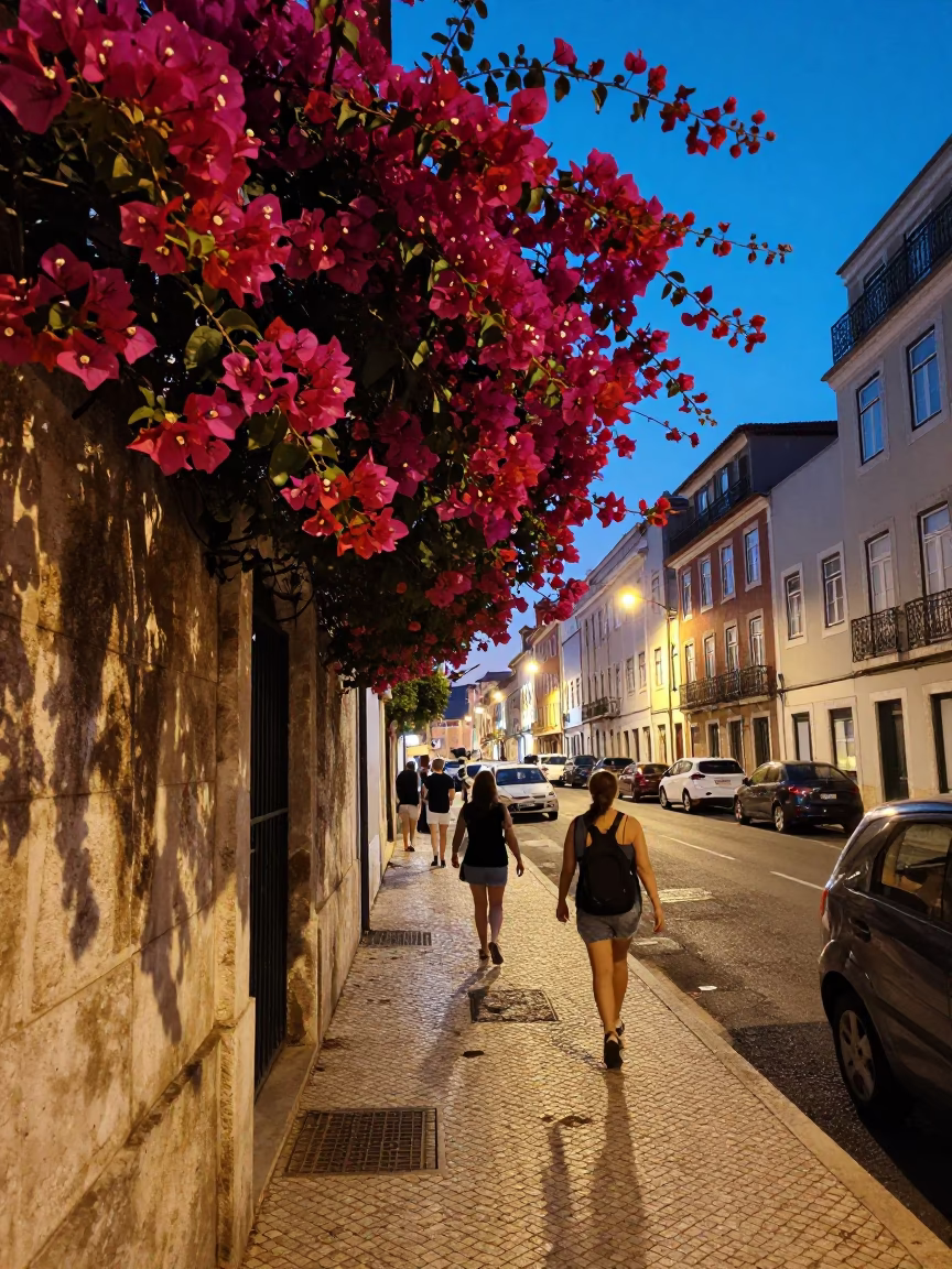 Busy Lisbon Street Corner at Dusk with Bougainvillea and Tram Tracks in in Lisbon, Portugal