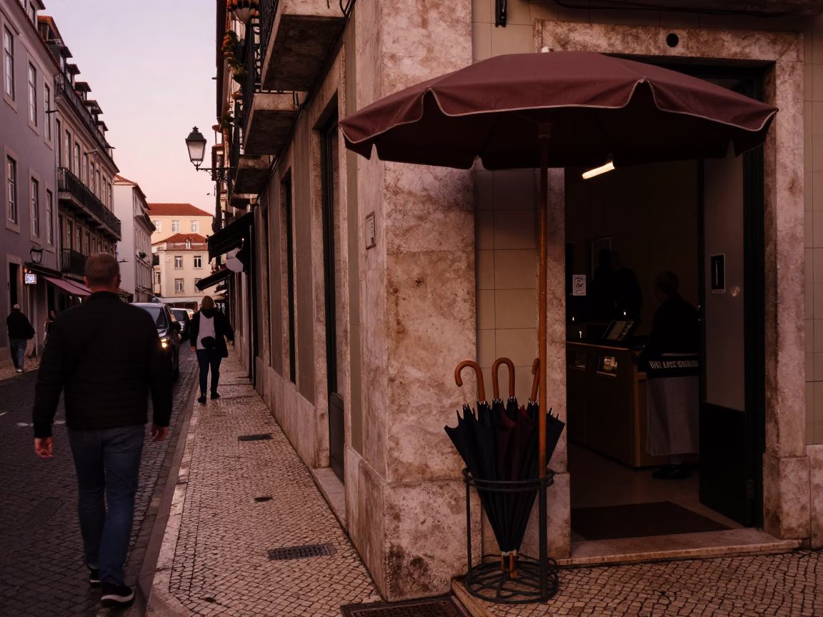 Busy Lisbon Street Corner in Copper Dusk Light with Umbrella Stand and Doormat in in Lisbon, Portugal