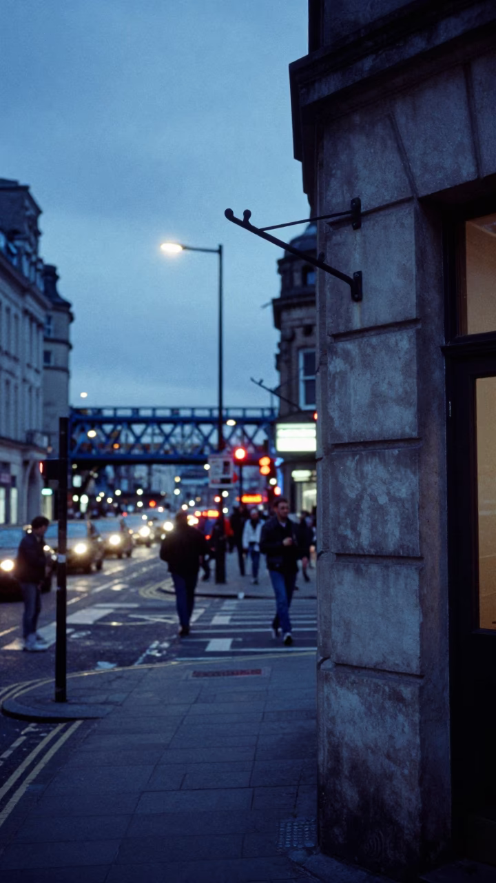 Busy Liverpool Street Corner at Dusk with Bridge Maintenance Cradle Over Green River Water in in Liverpool, United Kingdom