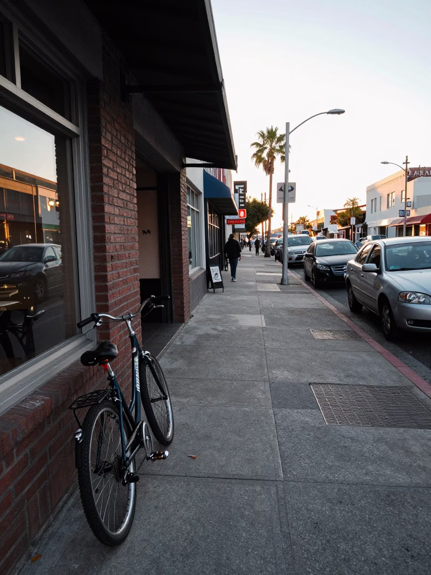 Busy Los Angeles Street Scene Early Morning with Bicycle and Cafe in in Los Angeles, California, United States