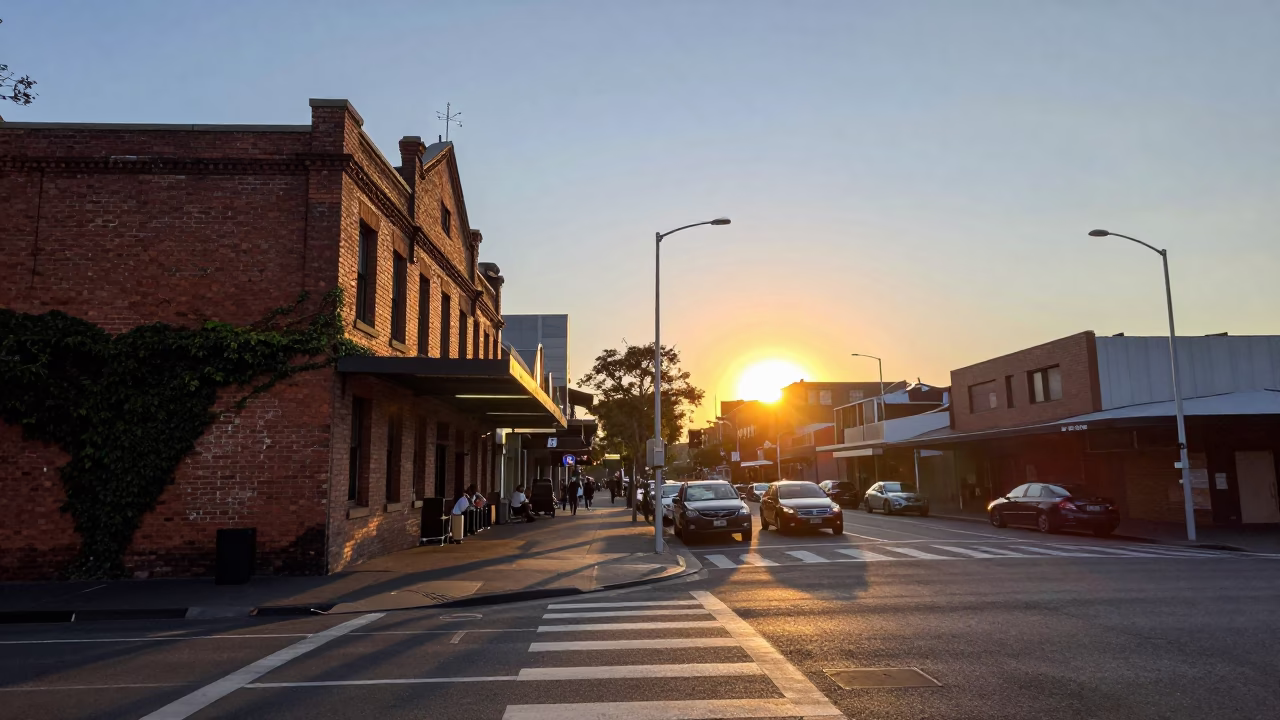 Busy Melbourne Street Corner at Sunset with Brick Architecture and Urban Activity in in Melbourne, Victoria, Australia