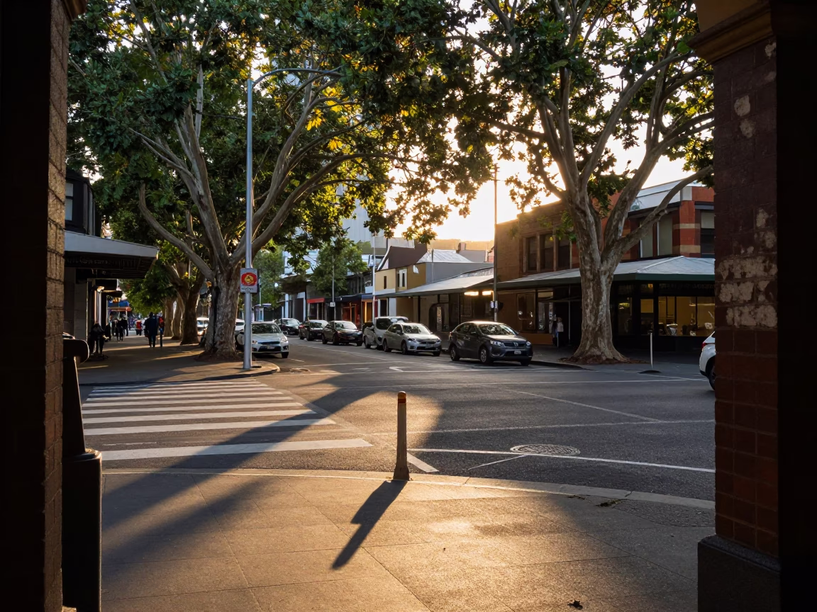 Busy Melbourne Street Scene at Sunset with Leaf Shadows and Local Details in in Melbourne, Victoria, Australia
