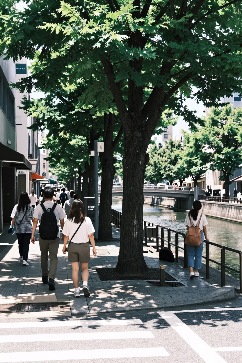 Busy Midday Street Scene in Fukuoka Japan with Tree and Canal in in Fukuoka, Japan