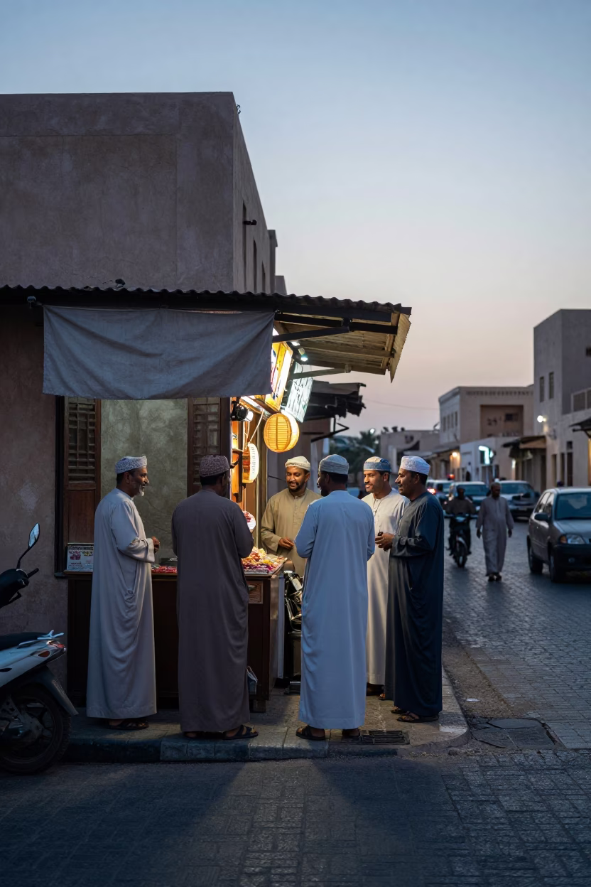 Busy Muscat Oman street corner at dawn with locals and traditional clay pots in in Muscat, Oman