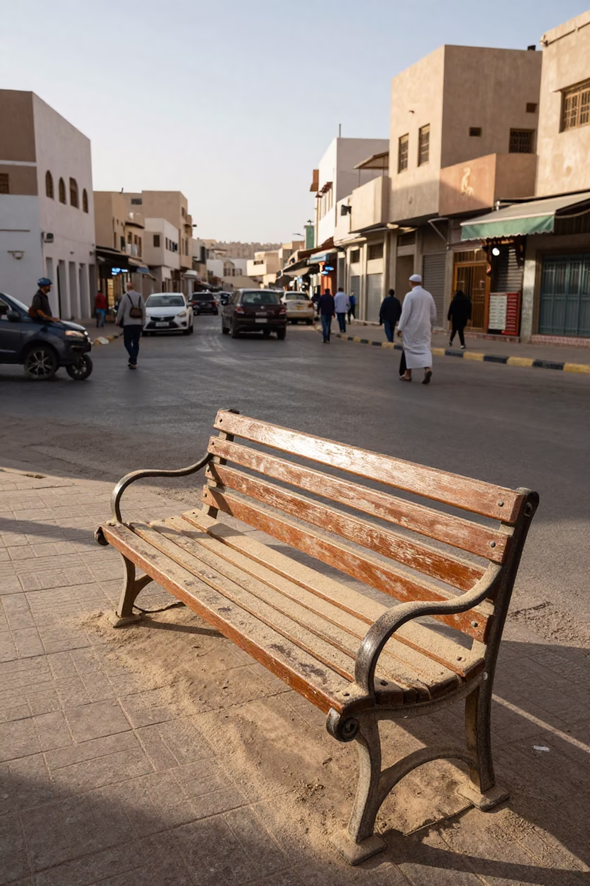 Busy Muscat Street Corner Afternoon with Magazines and Dusty Bench in in Muscat, Oman