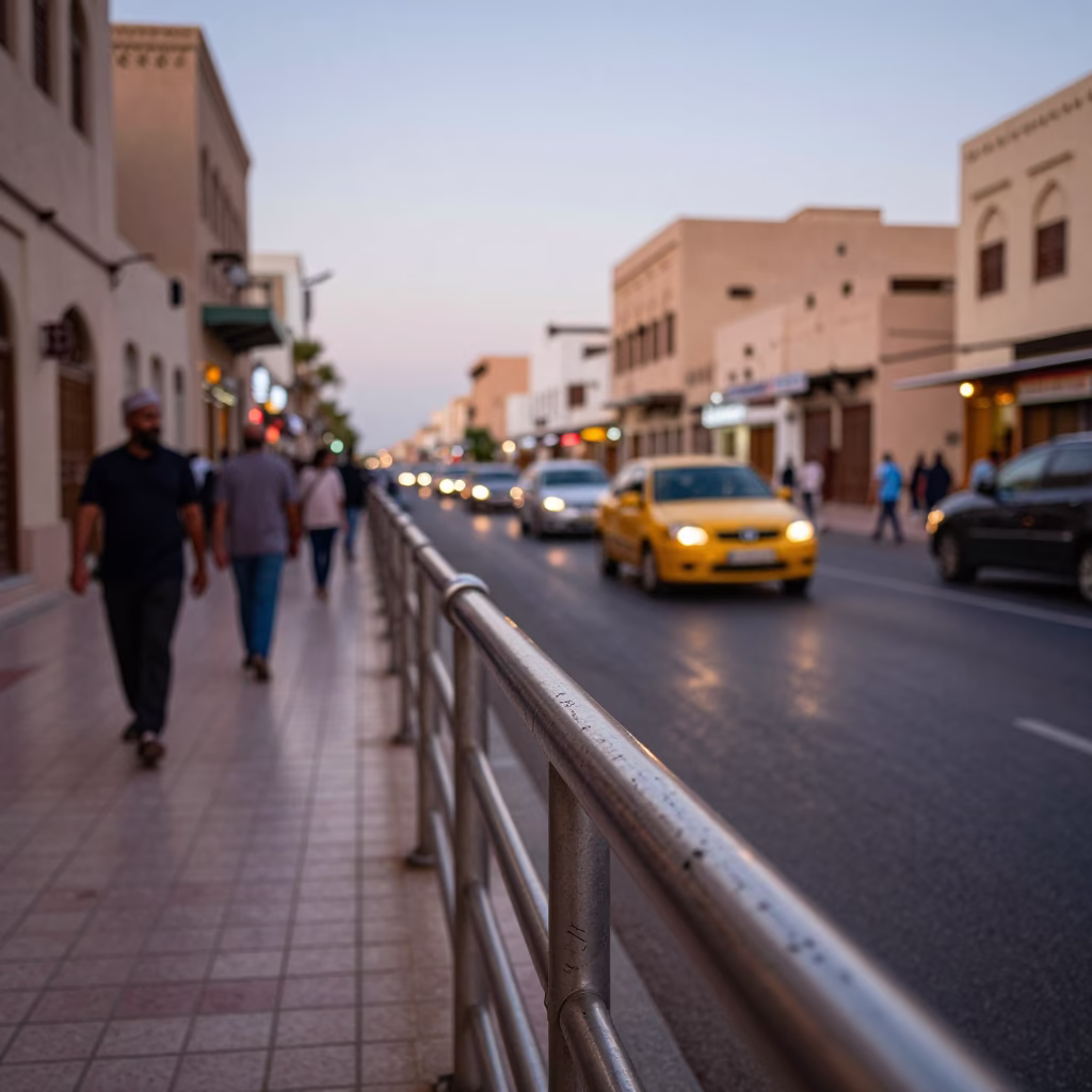 Busy Muscat Street Scene Early Evening with Traditional Architecture and Local Activity in in Muscat, Oman