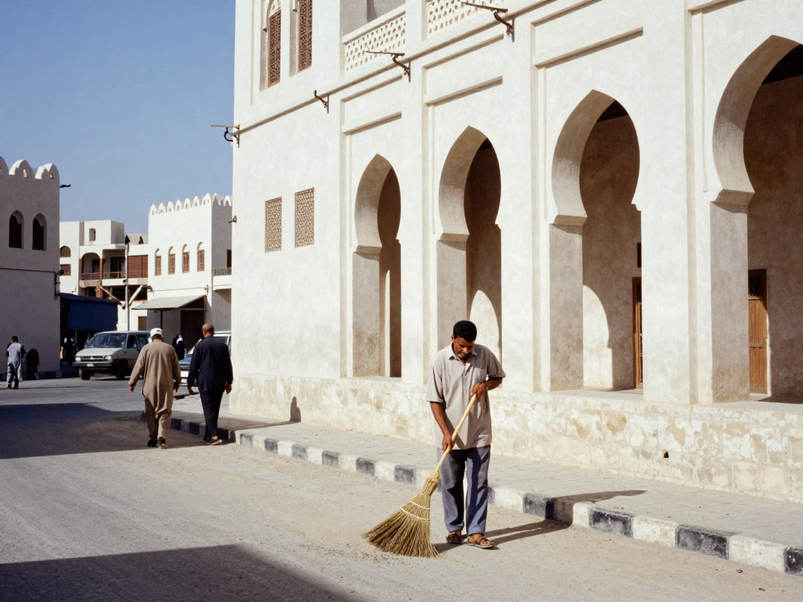 Busy Muscat Street Scene with Traditional Broom and Modern Architecture in Bright Midmorning Light in in Muscat, Oman