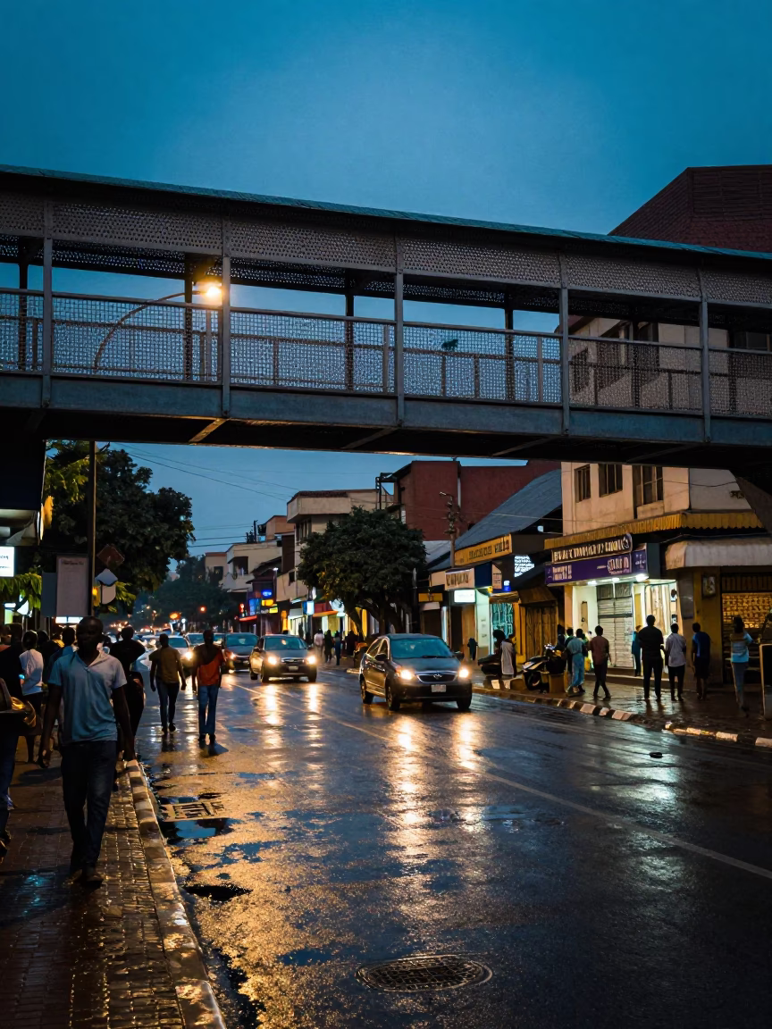 Busy Nairobi Street Scene at Twilight with Pedestrian Overpass and Urban Activity in in Nairobi, Kenya