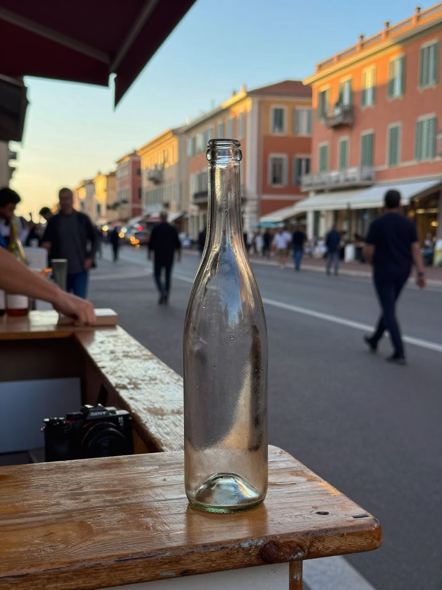 Busy Nice France Street Scene Late Afternoon Light with Glass Bottle and Cup in in Nice, France