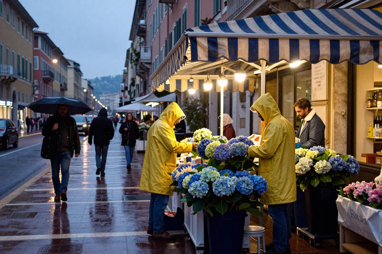 Busy Nice Street Scene in Light Rain at Dusk with Local Vendors in in Nice, France