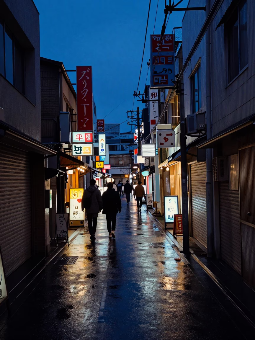 Busy Osaka Alleyway Street Scene Before Dawn with Wet Pavement and Neon Reflections in in Osaka, Japan