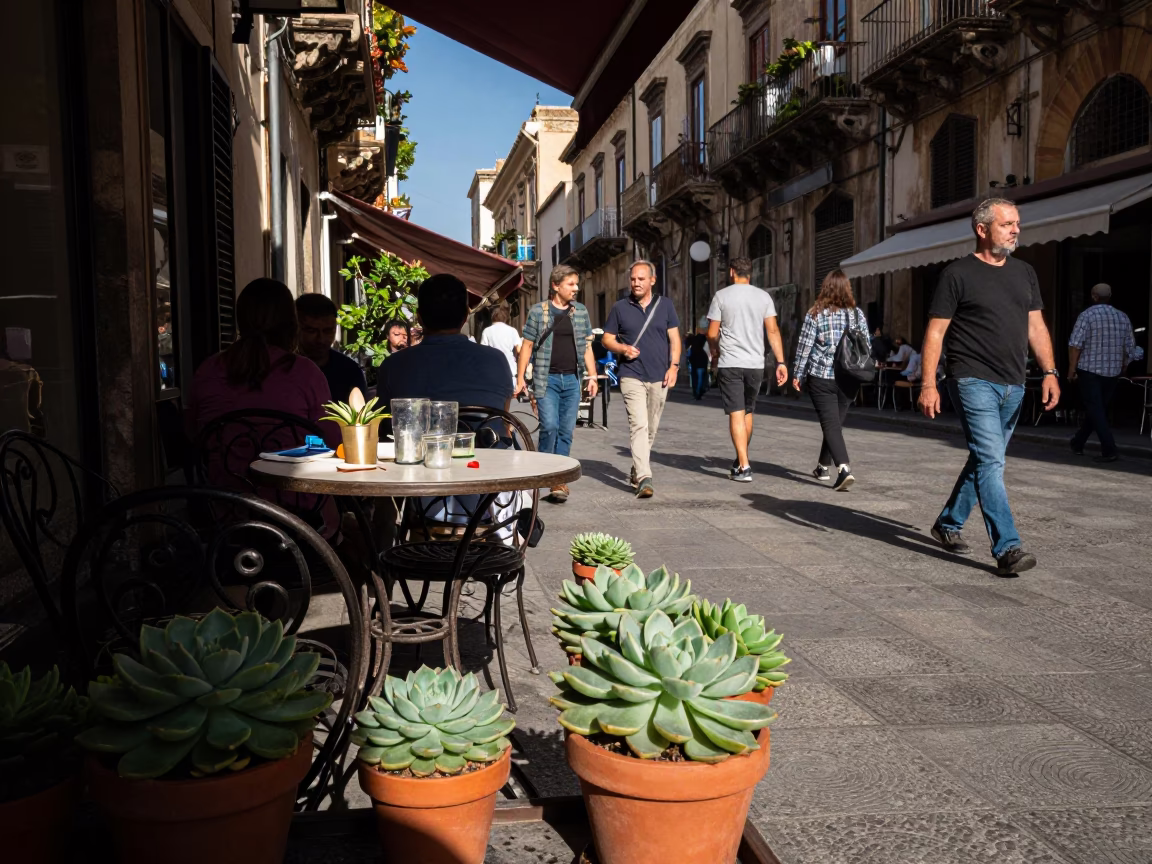 Busy Palermo Street Scene with Potted Succulents and Glass Tumbler in Late Afternoon Light in in Palermo, Italy