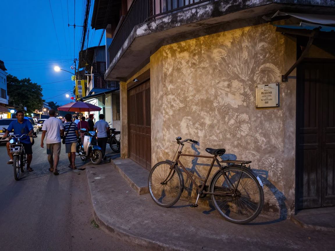 Busy Phnom Penh Street Scene at Dusk with Bicycle and Baguettes in in Phnom Penh, Cambodia