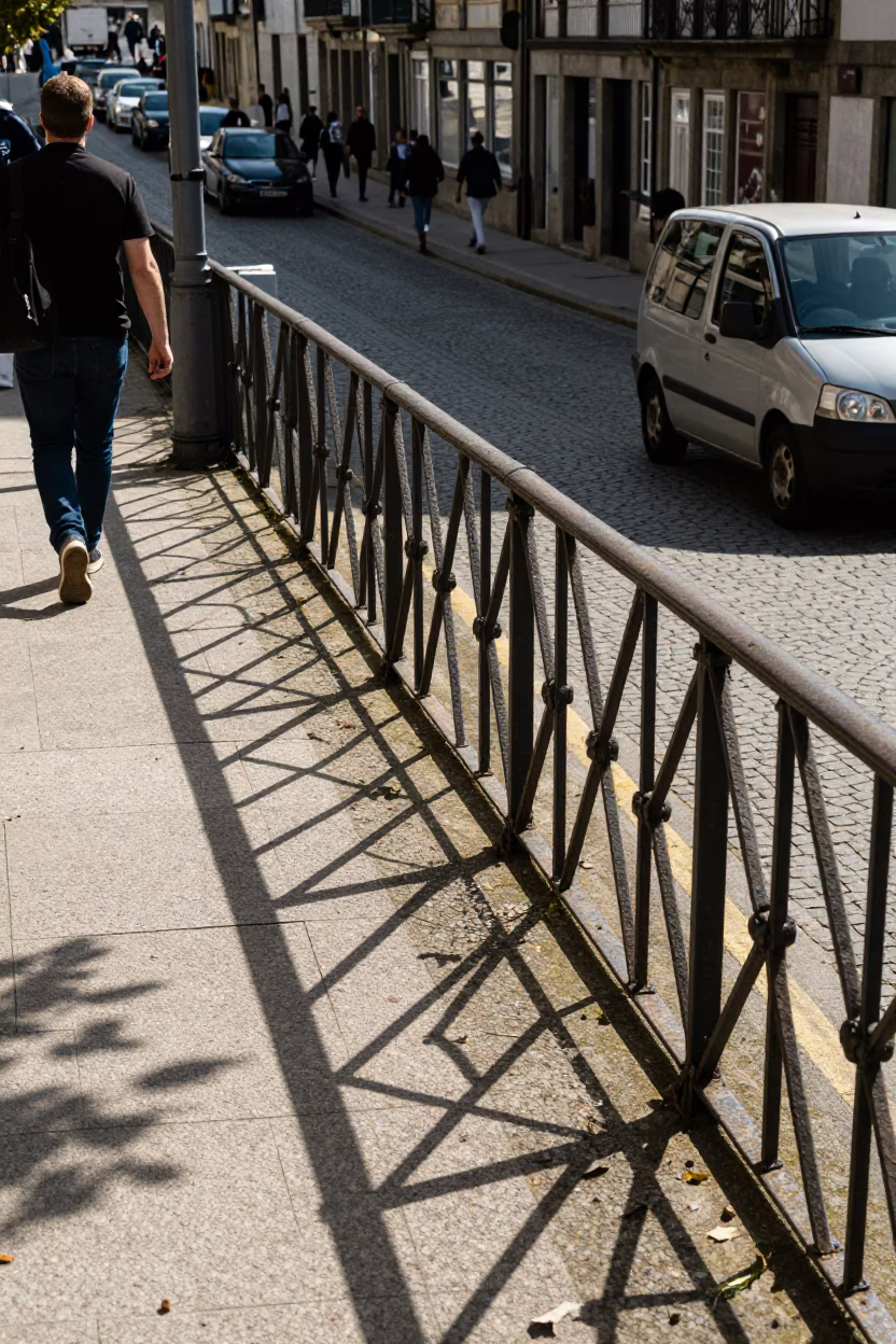 Busy Porto Street Scene with Leaf Shadows on Rail and Jam Jar in in Porto, Portugal