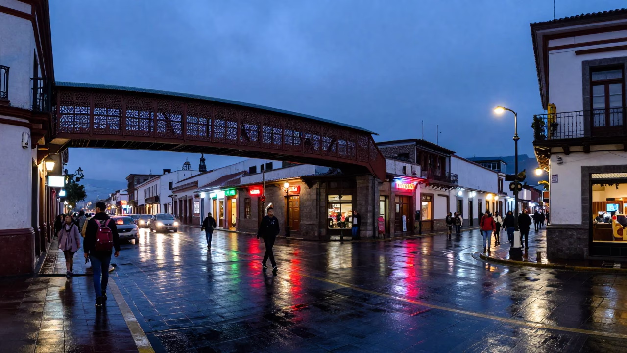 Busy Quito Ecuador Street Scene at Indigo Twilight with Pedestrian Overpass and Local Life in in Quito, Ecuador