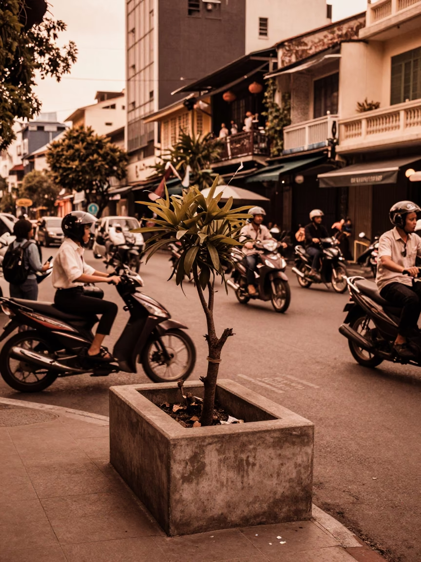 Busy Saigon Street Corner with Motorbikes and Potted Herbs in Copper Dusk Light in in Ho Chi Minh City, Vietnam