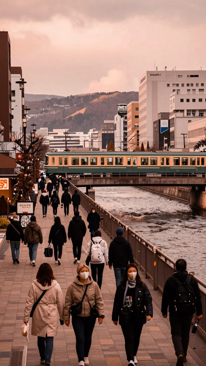 Busy Sapporo Street Scene in Copper Toned Light Before Dusk with Monorail and Ramen in in Sapporo, Japan