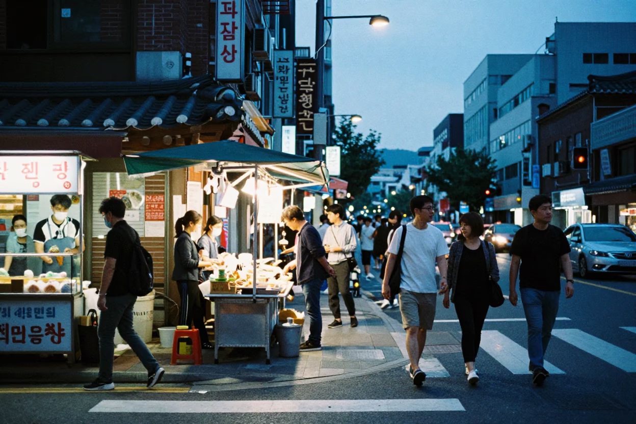 Busy Seoul Street Corner Evening with Vendor and Pedestrians in in Seoul, South Korea