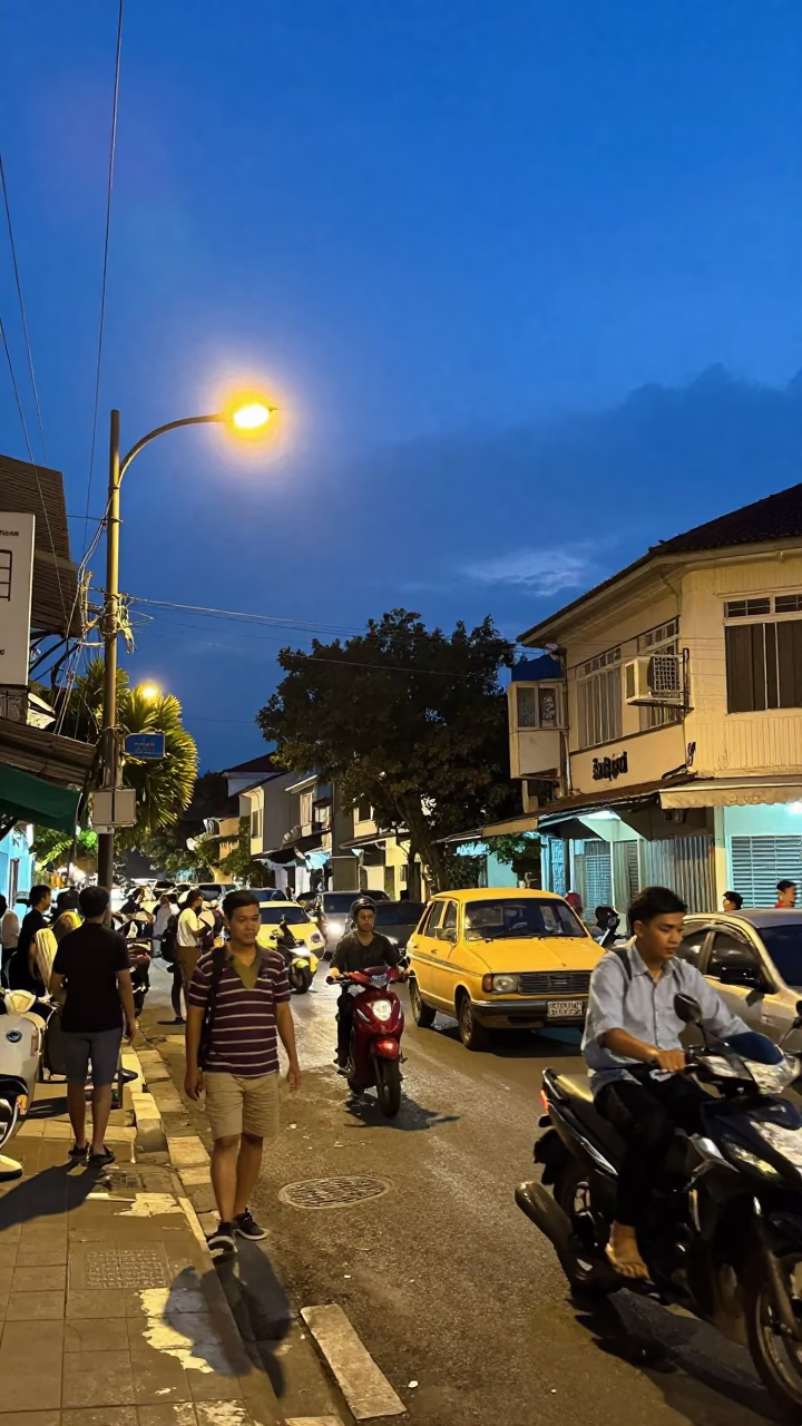 Busy Surabaya Street Scene at Blue Hour with Vintage 1960s Atmosphere and Local Life in in Surabaya, Indonesia