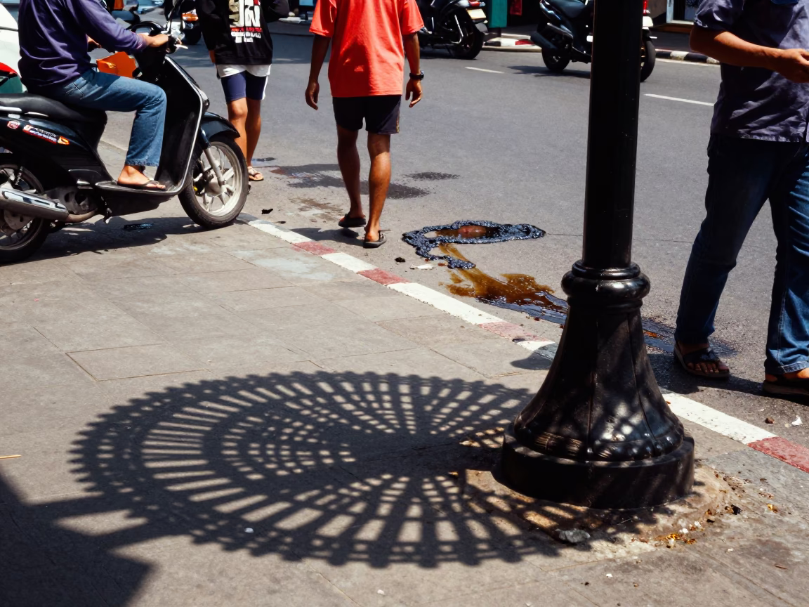 Busy Surabaya Street Scene with Wicker Shadow and Grease Sheen on Runner at Midday in in Surabaya, Indonesia
