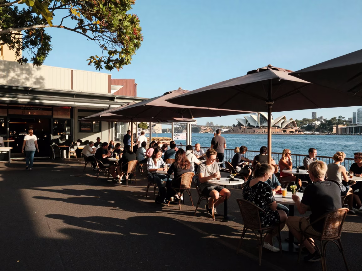 Busy Sydney Cafe Outdoor Dining Area in Late Afternoon Light with Local Patrons in in Sydney, New South Wales, Australia