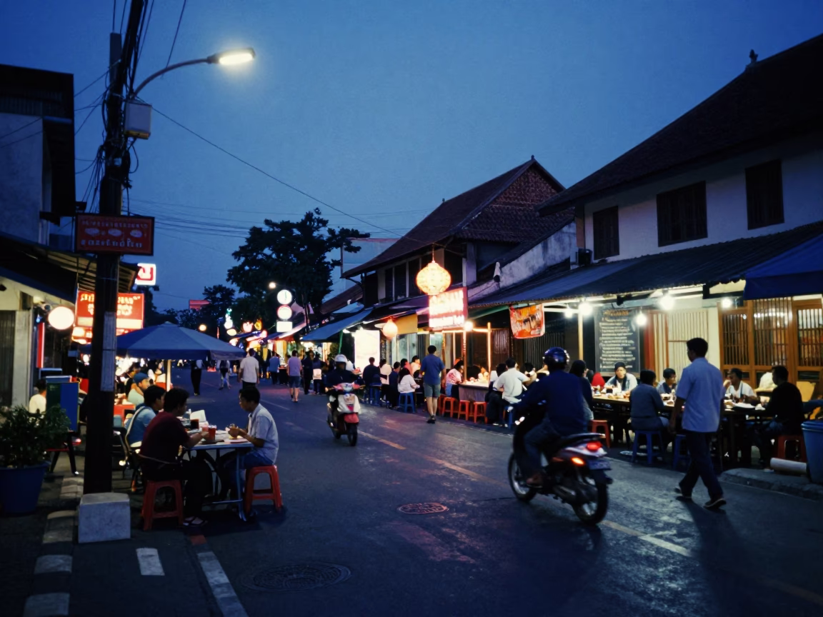 Busy Yogyakarta Street Scene at Blue Hour with Local Dining and Traditional Architecture in in Yogyakarta, Indonesia