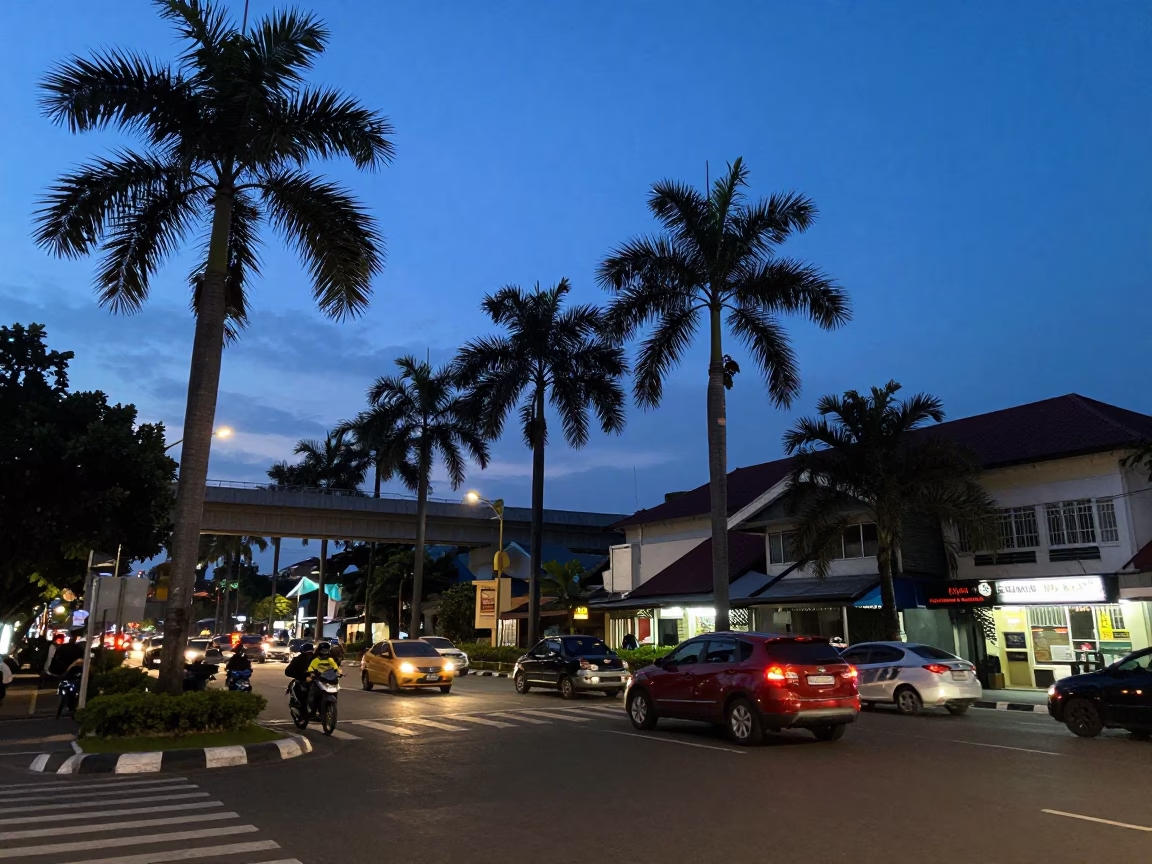 Busy Yogyakarta Street Scene at Blue Hour with Palm Trees and Taillight Streaks in in Yogyakarta, Indonesia