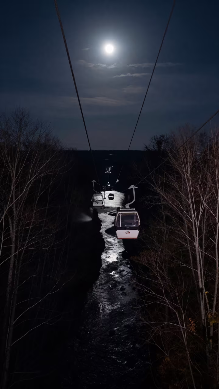 Cable Car Over River Valley at Night in on a wind-open causeway in Canada