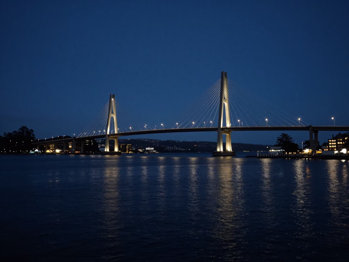 Cable-stayed Bridge Illuminated Against Dark Harbor in Predawn Hobart Tasmania in in Hobart, Tasmania, Australia