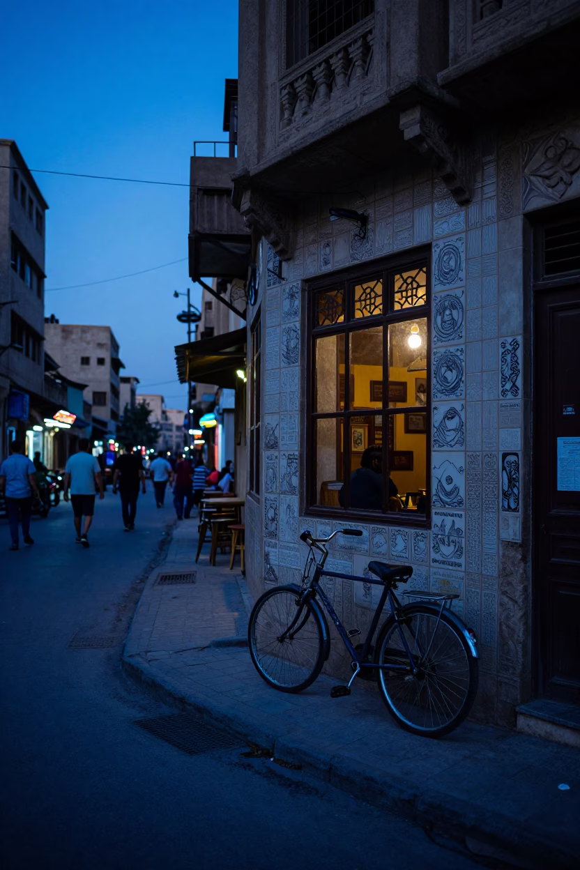 Cairo Egypt Twilight Street Scene with Bicycle and Cafe Window Writer in in Cairo, Egypt