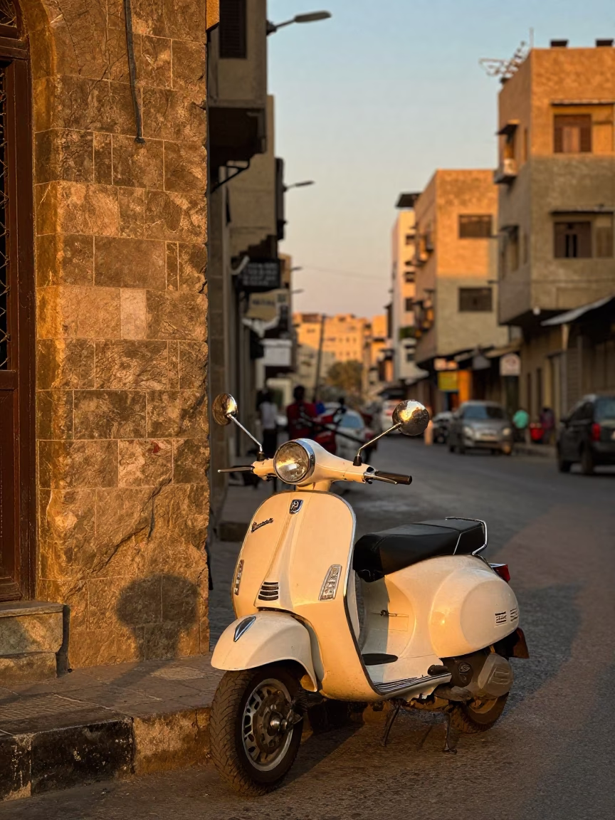 Cairo Sunset Street Scene with Vintage Vespa Reflection in Shop Window in in Cairo, Egypt