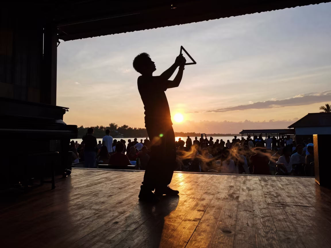 Cajun Triangle Player Silhouette at Sunset in at a jazz club in Sandakan
