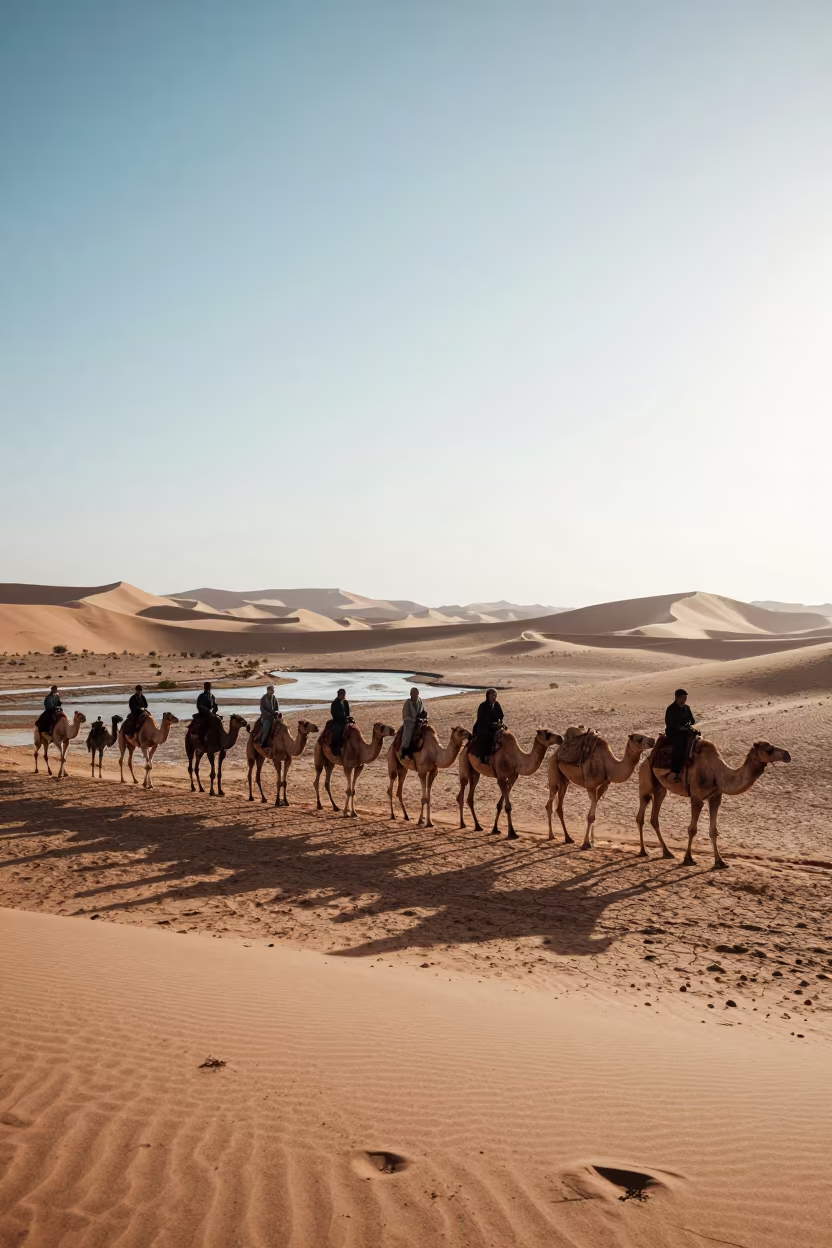 Camel Train Crossing Sand Dunes Near Isfahan in above a glacial stream near Isfahan