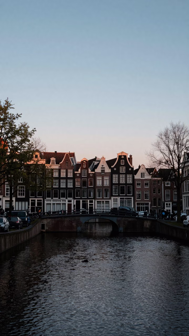 Canal in Amsterdam at Nautical Dawn Light in in Amsterdam, Netherlands