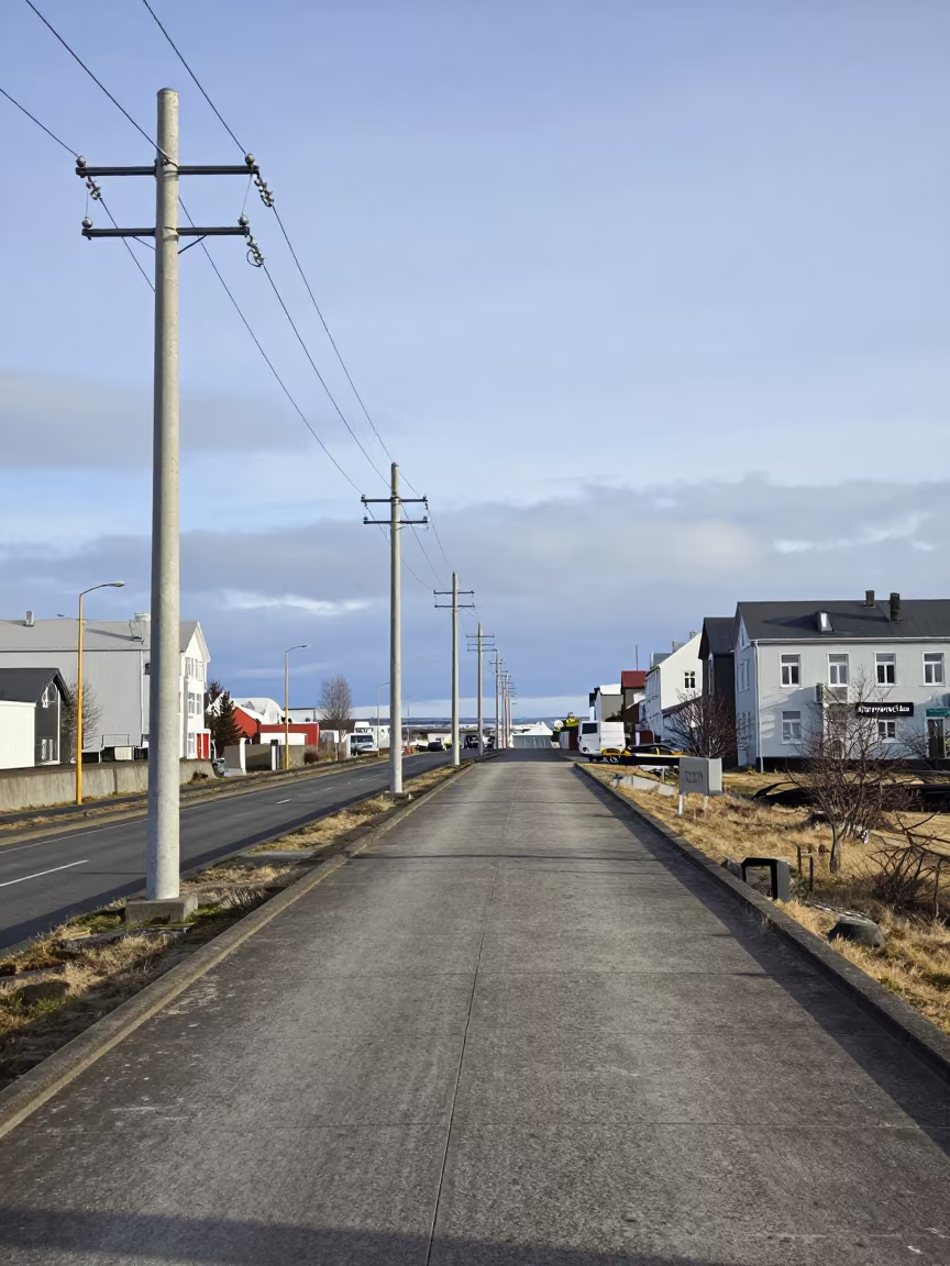 Canal Towpath Beneath Utility Poles in Reykjavik in across a windy overpass interchange near Grandi, Reykjavik