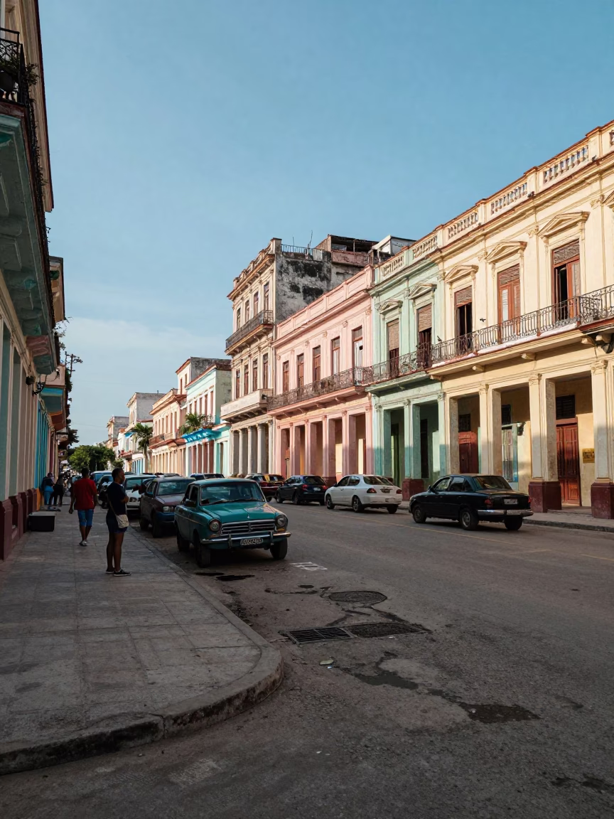 Candid street corner in Havana Cuba with parked cars and pedestrians in in Havana, Cuba