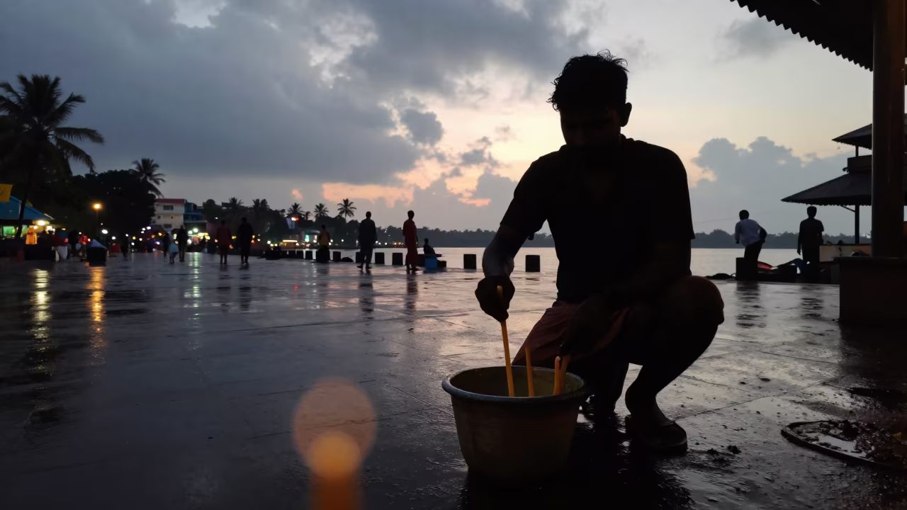 Silhouette of Candle Maker Dipping Tallow in Varkala Square in at a public square in Varkala
