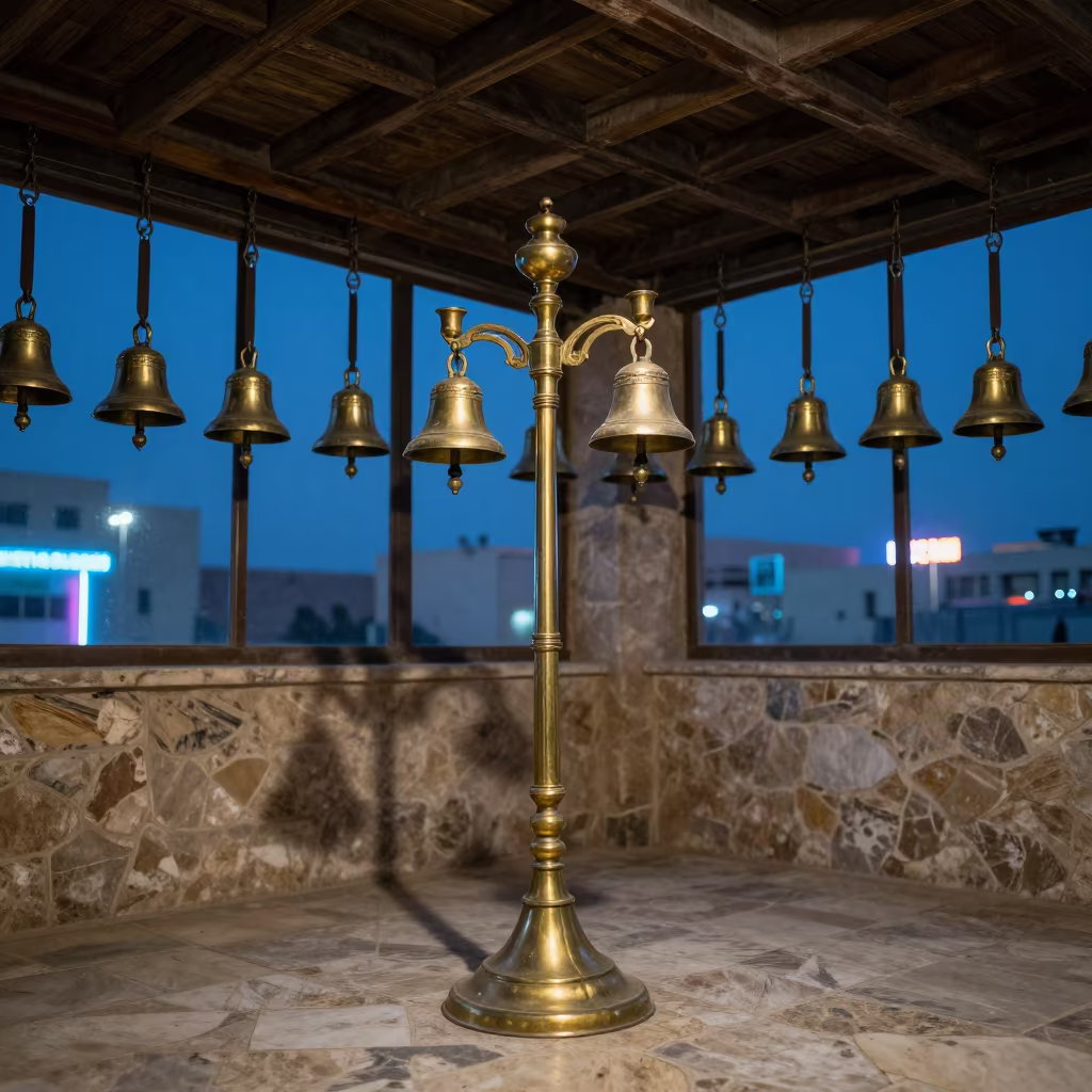 Candle Stand and Bells Under Basra Smoke Rafters in at the foot of a stone altar in Basra