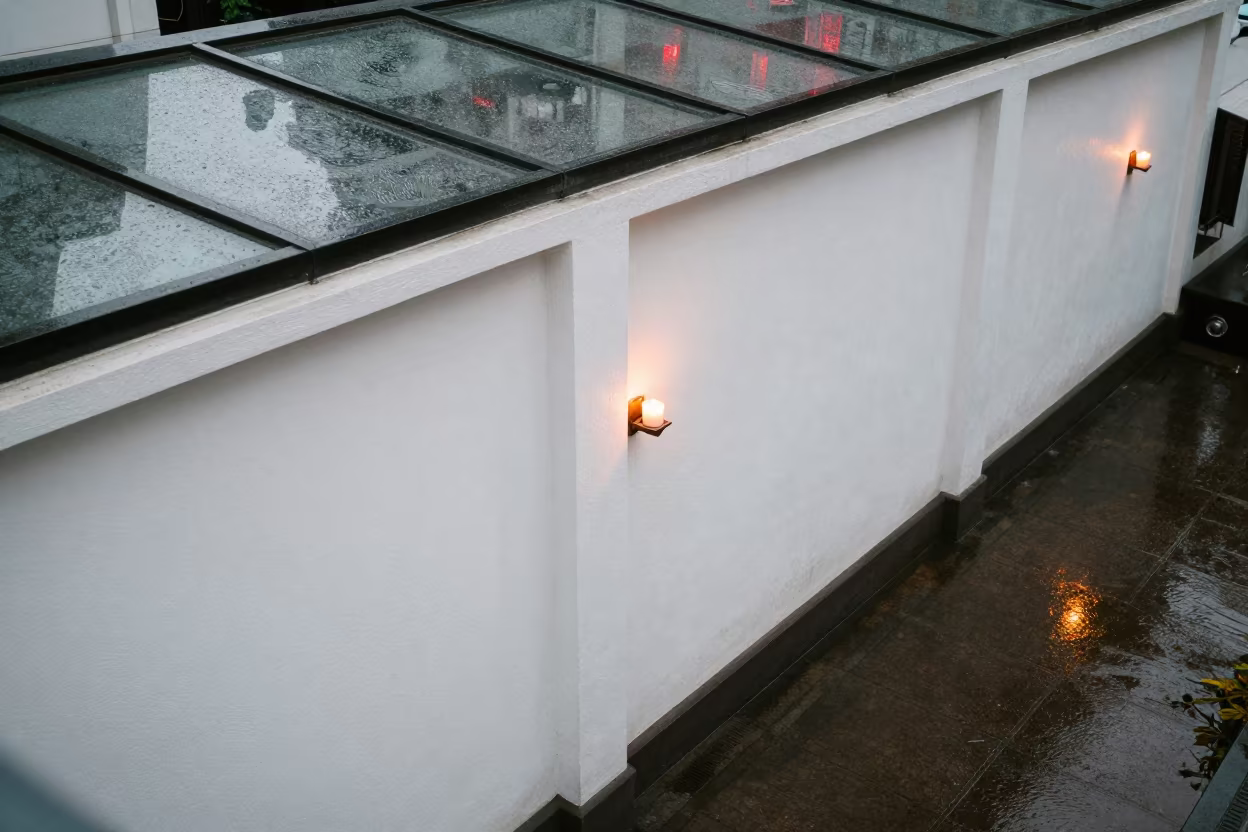 Candlelit Tail Light Reflections on Chennai Arcade Plaster in inside a glass-roofed arcade in Chennai