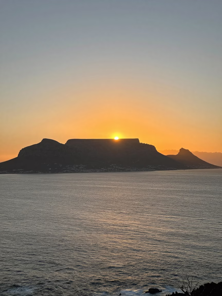 Cape Town Sunset View of Table Mountain and Atlantic Ocean Coastline in in Cape Town, South Africa