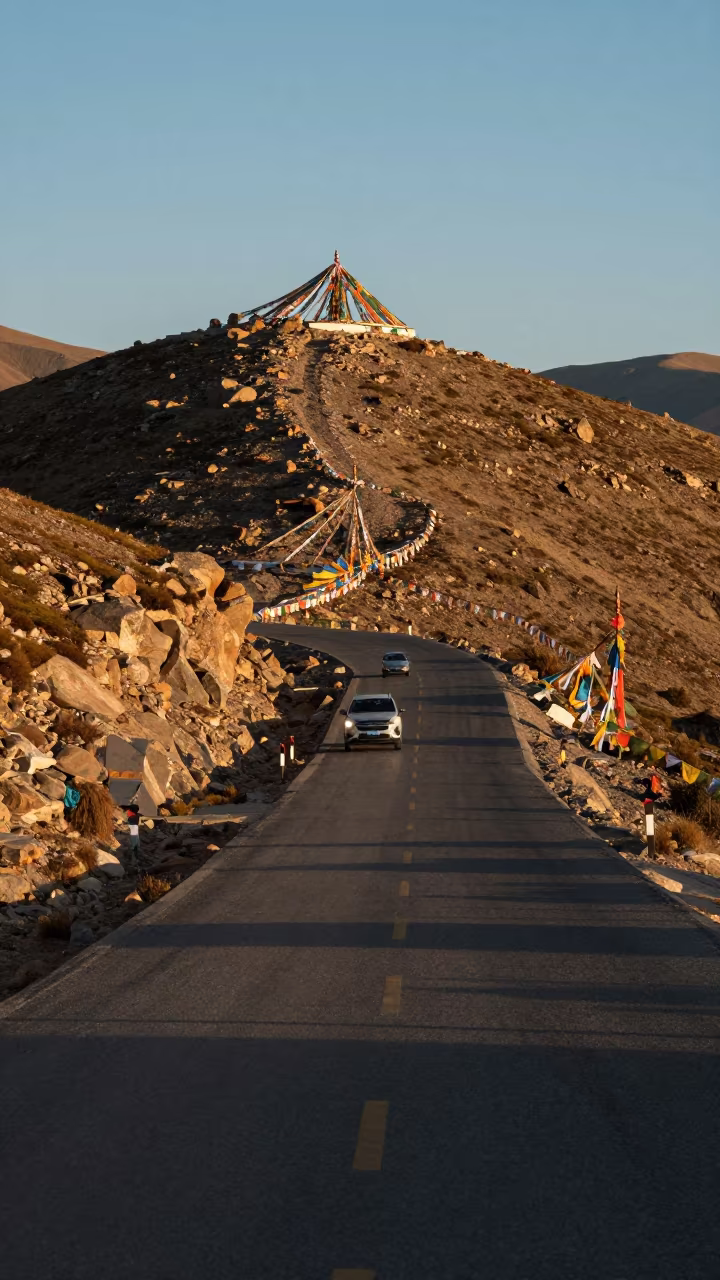 Car Headlight Trails on Lhasa Mountain Ridge in on a wind-cut ridge below prayer flag lines near Lhasa