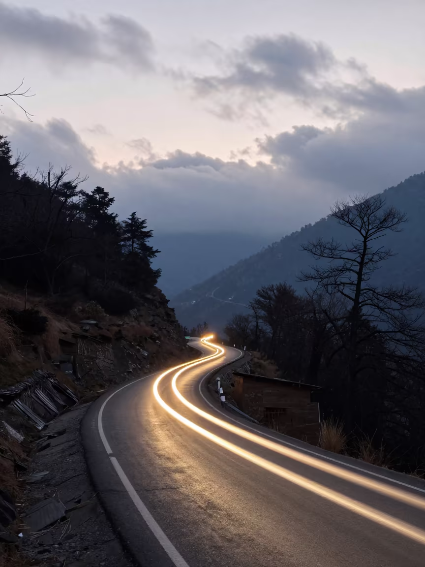 Car Light Trails on Uttarakhand Mountain Road in along a switchback approach in Uttarakhand