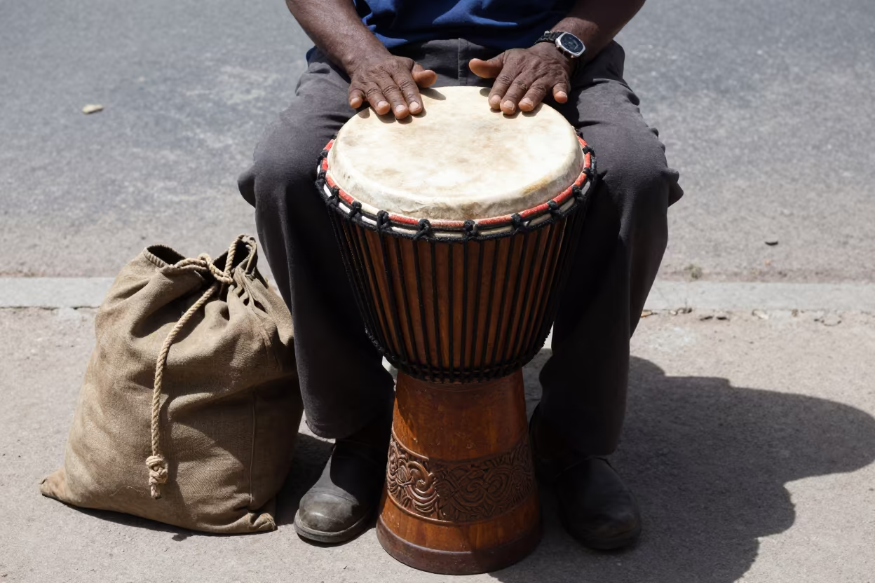 Carved Djembe Drum at Maykop Street Corner in at a street corner busking spot in Maykop