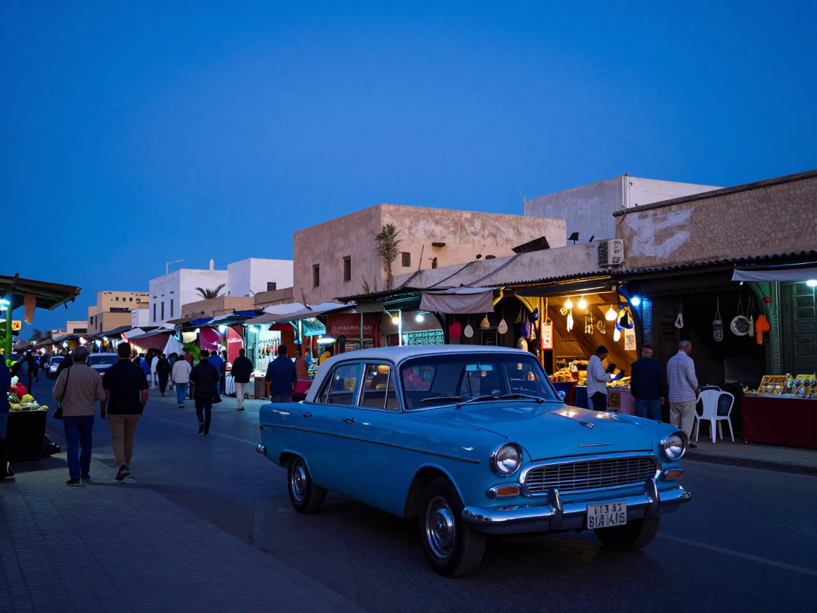 Casablanca Morocco street scene at blue hour with vintage car and local market activity in in Casablanca, Morocco