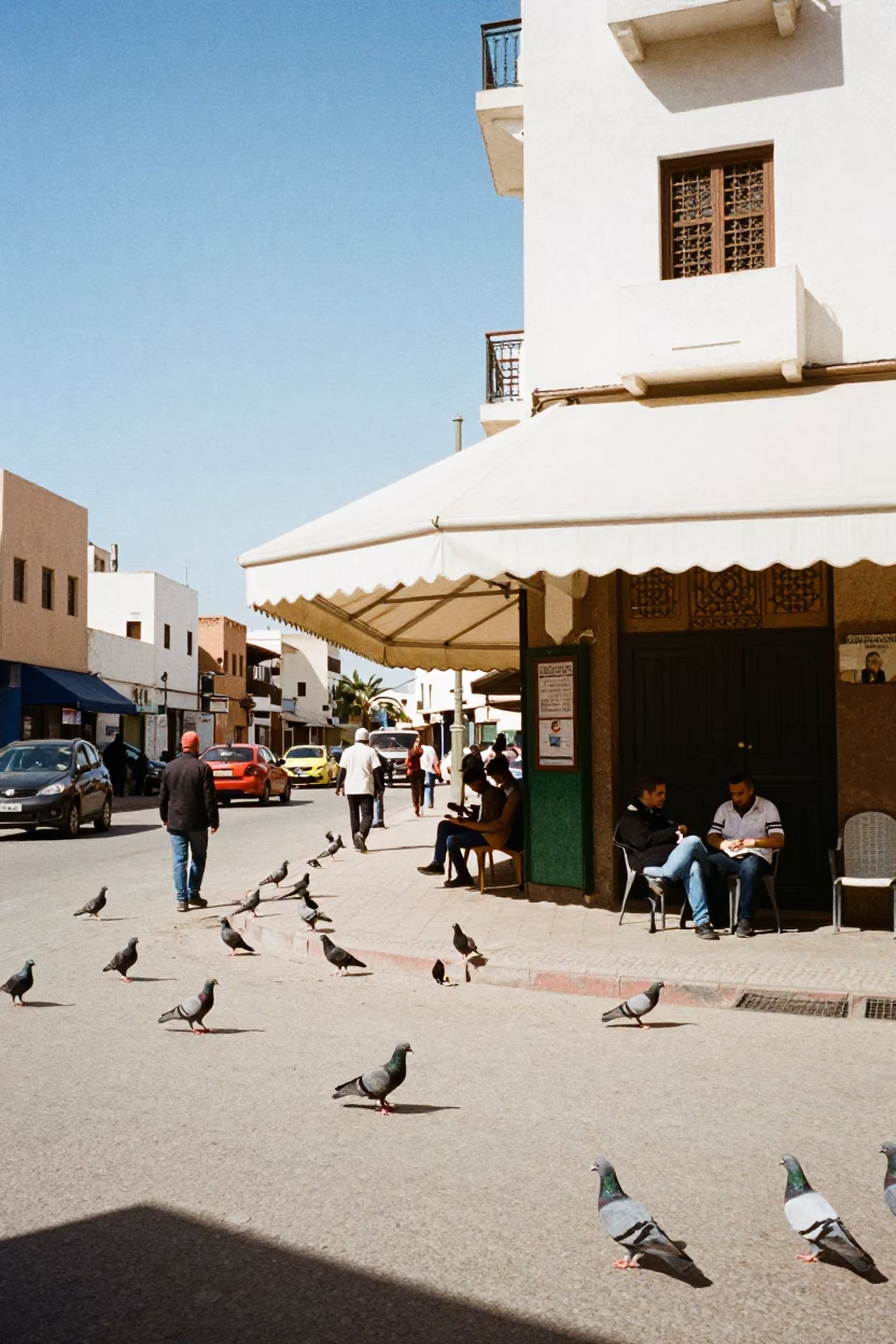 Casablanca Street Scene Under Noon Sun With Pigeons And Hotel Valet Stand in in Casablanca, Morocco