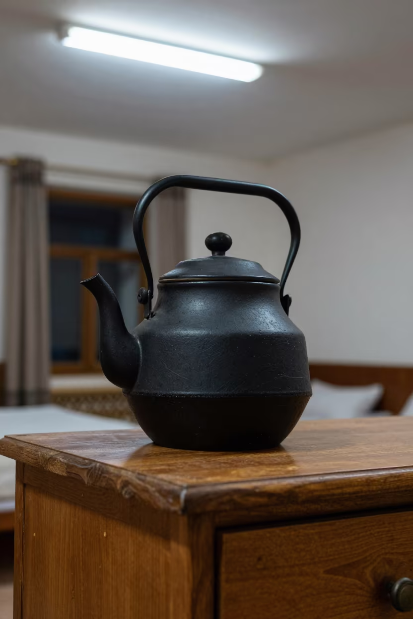 Cast Iron Teapot on Bukhara Hotel Dresser in on a hotel dresser in Bukhara