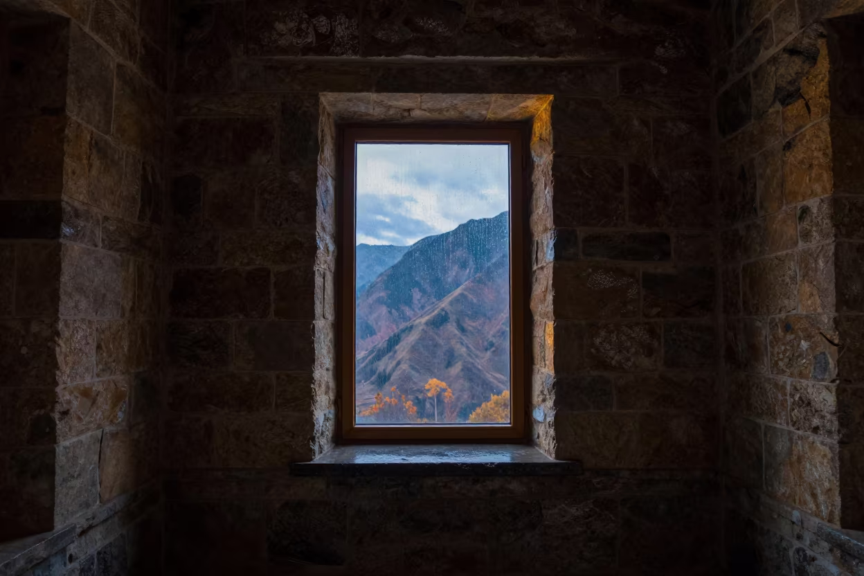 Castle Keep Window Framing Twilight Mountains in Bishkek in inside a vaulted atrium near Bishkek