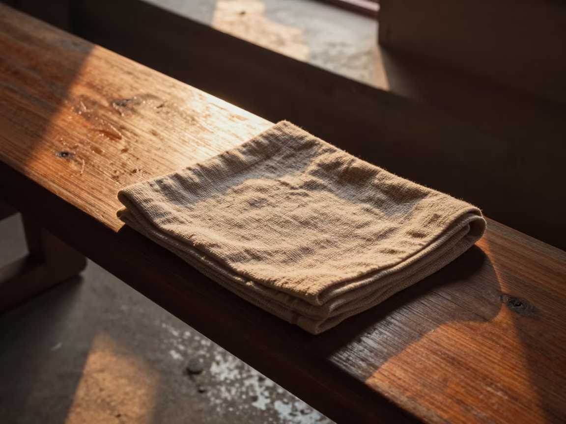 Cedar Bench Tea Towel Jhansi Sunset in on a painted display ledge in Jhansi