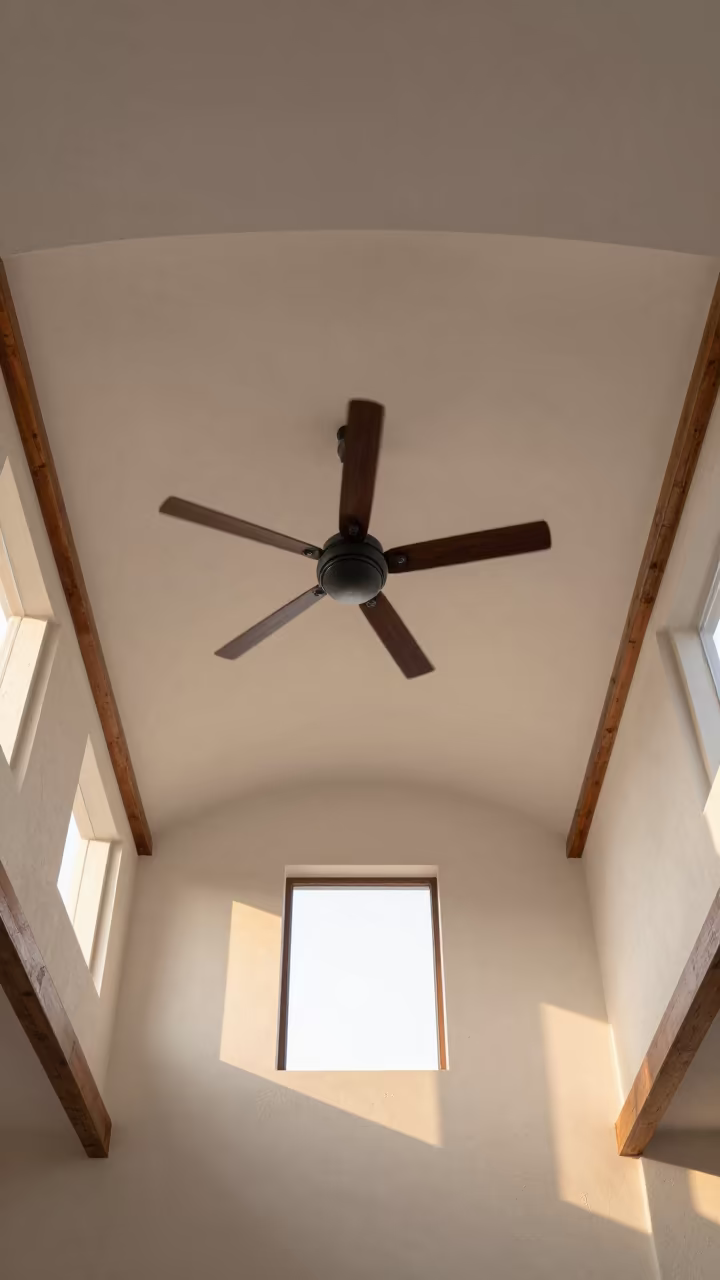 Ceiling Fan Shadow Play on Whitewashed Atrium Ceiling in inside a vaulted atrium near Zhangjiajie